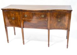 A George III style mahogany serpentine fronted sideboard on square tapering legs with spade feet,