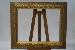 An oak and gesso laurel leaf moulded frame to take picture 71cm x 91cm