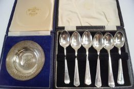 A cased set of six silver coffee spoons; another similar set of six;