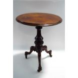A Victorian and later mahogany tripod table, on scroll legs raised on brass castors,
