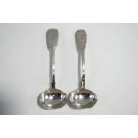 A pair of Georgian silver sauce ladles, by William Chawner, London 1824, fiddle pattern, crested,