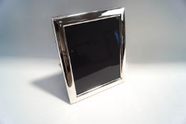 A large silver photograph frame, by Carrs, Sheffield 2015, of plain rectangular outline,