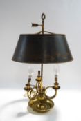 A French brass triple branch bouillotte lamp, with rise and fall mechanism and toleware shade,