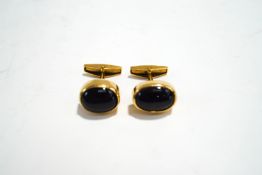 A pair of black chatoyant cabochon set cufflinks, stamped '18K' and 'Renkia',