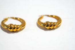 A pair of 9 carat gold hollow hoop earrings, 3.