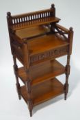A mahogany three tier whatnot with raised mirrored back,