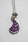 A diamond and pink sapphire pendant, stamped '18K' and 'Chameleon',