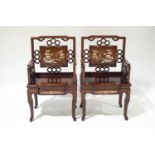A pair of Chinese elbow chairs,