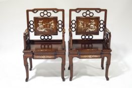 A pair of Chinese elbow chairs,