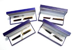 A Waterman fountain pen with 18K nib, a further Waterman slim fountain pen with 18K nib,