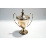 A silver two handled trophy cup and cover, Birmingham 1931,