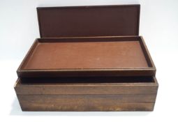 An early 20th century oak set of four specimen trays, with lid, 29.5cm x 53.