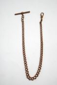 A 9ct rose gold watch chain, of graduated solid curb links, with a T bar and swivel catch, 36.