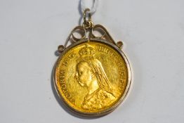 An 1887 two pound gold coin, in a 9 carat gold scroll top pendant mount,