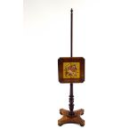 A William IV rosewood pole screen, with woolwork panel of a bouquet of flowers, upon a triform base,