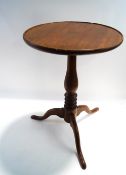 A mahogany tripod table with fixed top,