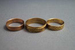 A collection of three 9 carat gold rings, 6.