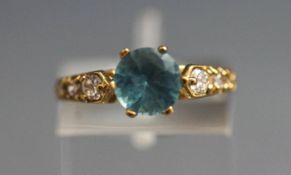 A 9 carat gold blue topaz and synthetic stone set dress ring, finger size L1/2, 2.
