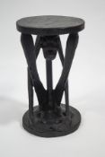 An African tribal carved stool, possibly Cameroon, 49.