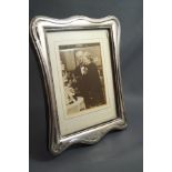 A modern silver photograph frame, of rectangular shaped outline, 25 cm by 19 cm, image area 18.