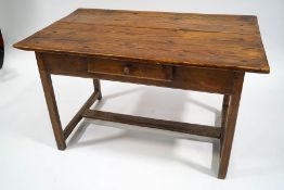 An early 19th century pine and elm kitchen table, possibly French, with single drawer,
