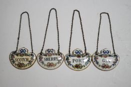 A set of four Crown Staffordshire ceramic decanter labels