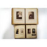 Two Victorian photograph albums and various loose photographs mounted on card,