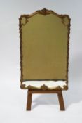 A rectangular gilt frame pier mirror with scroll and flower modelled surround,