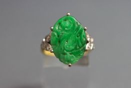 A jade and diamond ring, stamped '18ct',