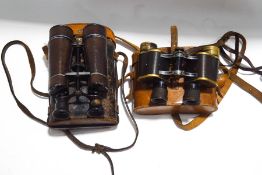Two pairs of early 20th century German binoculars, one by Bausch & Lomb , the other by Busch,
