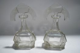 A pair of Art Deco style glass scent bottles, and stoppers with frosted vine moulded detail,