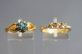 A 9 carat gold stone set dress ring, finger size P; and a 9 carat gold cluster dress ring; 5.