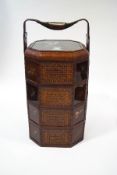A Chinese four tier wedding basket with back painted glass side panels,