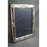 A modern silver photograph frame, of rectangular outline, 23 cm by 18.