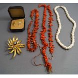 A collection of jewellery, including; coral necklaces,