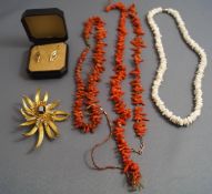 A collection of jewellery, including; coral necklaces,