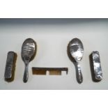 A pair of silver dressing table hair brushes; pair of clothes brushes;