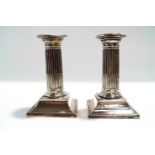 A pair of Victorian loaded silver desk candlesticks, by Harrison Brothers and Howson,