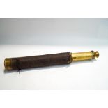 A late 19th century brass two drawer telescope, with woven thread covering,