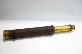 A late 19th century brass two drawer telescope, with woven thread covering,