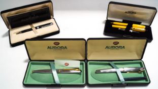An Italian Aurora yellow cased fountain pen and ballpoint pen set,