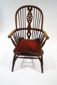 A 19th century beech and elm wheel back Windsor chair, stamped 'R.