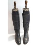 A pair of Gentleman's black leather riding boots with original trees