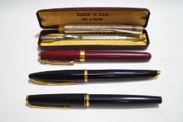 A Montblanc fountain pen with 14ct nib, a Waterman Carene fountain pen, a Sheaffer ballpoint pen,