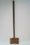 A 19th century copper chestnut warmer with ash handle,
