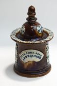 A Victorian Bargeware tobacco jar and cover, with motto 'Fill Your Pipe and Welcome', 18.