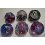 Six Caithness paperweights: Extravaganza, Aries, Moonflowers, Flamenco, Fiesta,