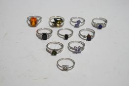 A collection of ten silver and silver coloured stone set rings