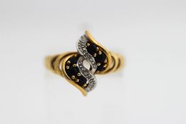 A 9 carat gold sapphire and diamond dress ring, finger size M1/2, 2.
