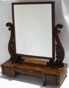A Victorian flame mahogany dressing table with three drawers to the base,